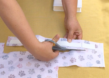 Cutting out the fabric.